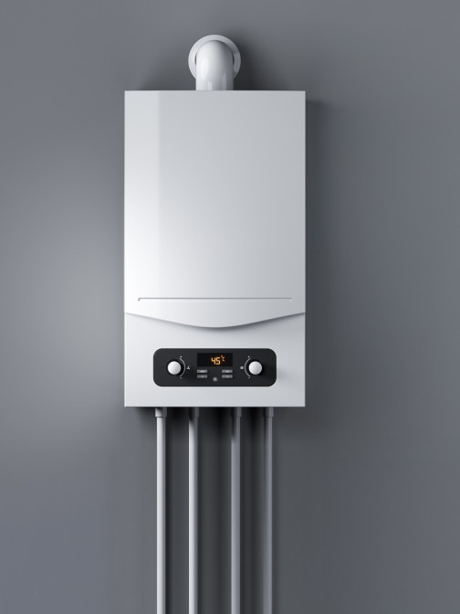 Gas-Wasserboiler hängt an einer grauen Wand.